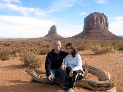 
Rudolf de Haan, left,  and Caroline Bussey pose Nov. 23 with the Left and Right Mittens in Monument Valley Navajo Tribal Park, Ariz., while on a Contiki tour. The couple met in 2004 on a Contiki tour in Europe.
 (Associated Press / The Spokesman-Review)