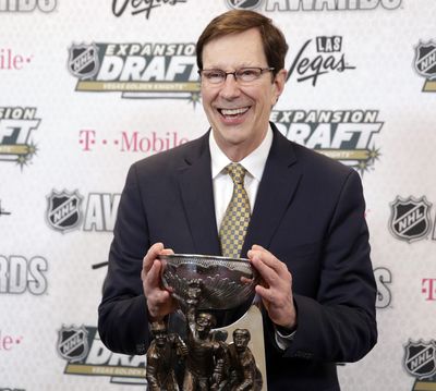 FILE - In this June 21, 2017, file photo, David Poile, general manager of the Nashville Predators, poses with the NHL General Manager of the Year Award after winning the honor at the NHL Awards in Las Vegas. Poile headlines the 2018 class of the U.S. Hockey Hall of Fame. (AP Photo/John Locher, File) ORG XMIT: NY171 (John Locher / AP)