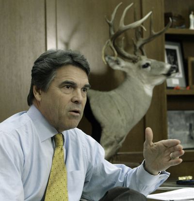 Texas Gov. Rick Perry responds to a question in his Capitol office on Thursday about  President Obama’s school-time speech  next week.  (Associated Press / The Spokesman-Review)