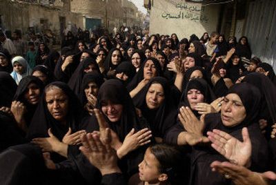 
Women grieve during al-Sistani aide's funeral.
 (The Spokesman-Review)
