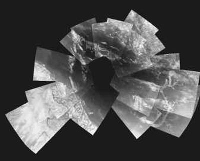 
This image taken from the European Space Agency  Web site  Tuesday shows a composite of 30 images from the Huygens probe. They were taken from an altitude varying from 13 kilometers  to 8 kilometers when the probe was descending toward its landing site. Huygens was dropping almost vertically at a speed of about 5 meters a  second. It was drifting horizontally at a speed of about 1 meter a second. These images were taken with a resolution of about 20 meters a pixel and cover an area extending out to 30 kilometers. 
 (Associated Press / The Spokesman-Review)