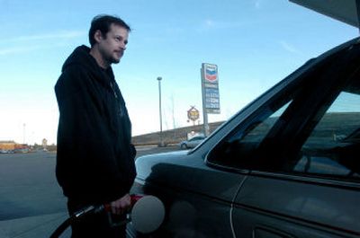 
Paul Schopfer pumps  gas at the Coeur d'Alene Casino station near Worley on Wednesday. 
 (Jesse Tinsley / The Spokesman-Review)