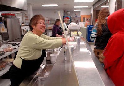 
Bev Davis chats with students in the breakfast line at Post Falls High  School. 
 (Jesse Tinsley / The Spokesman-Review)