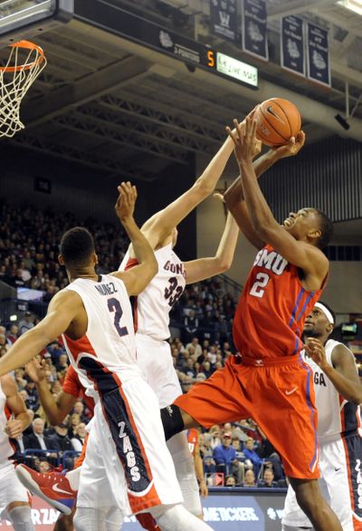 Gonzaga's Kyle Wiltjer (33) puts a block on SMU's Yanick Moreira (2) but is called for the foul in the first half Monday, Nov. 17, 2014 at the McCarthey Athletic Center at Gonzaga University. (Jesse Tinsley / The Spokesman-Review)