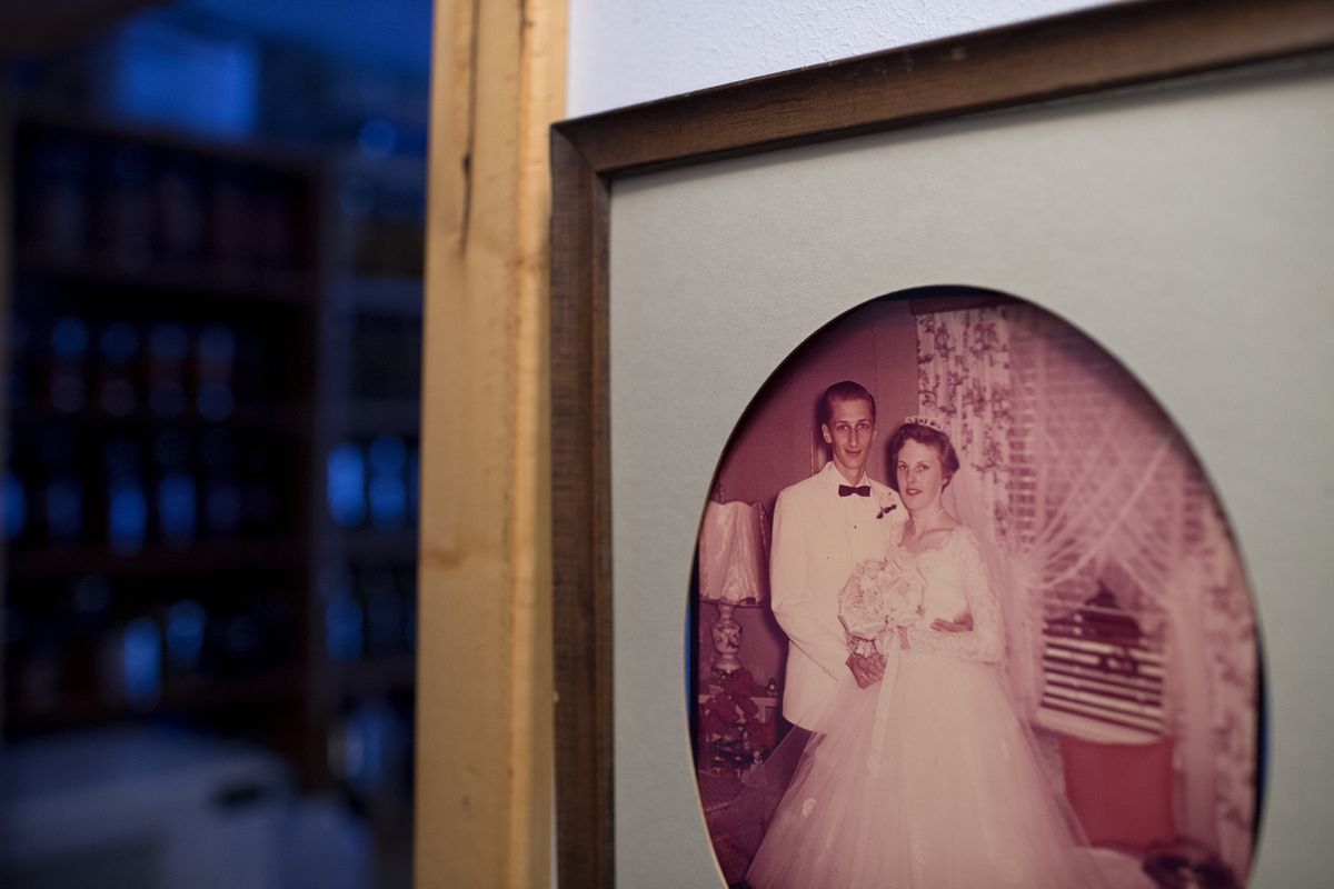 The Fallers’ 1957 wedding photo is displayed in their home. “Oh, my God. She made me cry,” said Bob Faller, recalling the first time he saw Jane, working in a Macy’s in New York City.