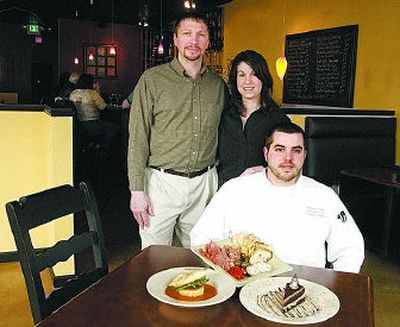 
Owner  Scott Cook,  his wife, Kara, and executive chef Jeremiah Timmons  pose in The Ambrosia Bistro and Wine Bar in Argonne Village.
 (J. BART RAYNIAK / The Spokesman-Review)