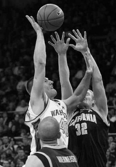 UW's Jon Brockman shoots over Cal's Taylor Harrison.
(Associated Press / The Spokesman-Review)