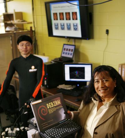 University of Texas at Arlington professor Fillia Makedon, right, and Kevin Xu, who is wearing a suit that digitally captures motion, do research at the Human-Centered Computing Laboratory. McClatchy Tribune (McClatchy Tribune / The Spokesman-Review)