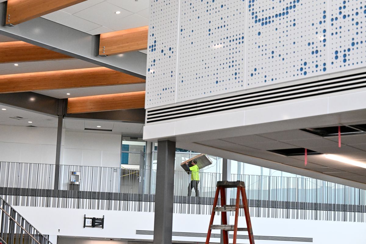 Workers put the finishing touches on Flett Middle School on Wednesday, Aug. 24, 2022, in Spokane, Wash.  (Tyler Tjomsland/The Spokesman-Review)