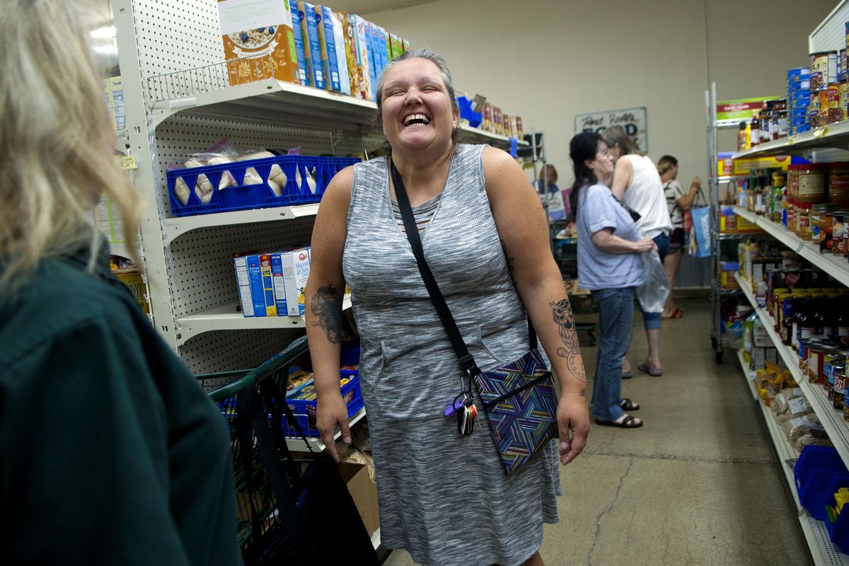 "You get to shop for yourself," said Heather Hjelmstrom as she talks about Post Falls Food Bank aka Third Avenue Market on Thursday, Aug. 9, 2018. Summer meal programs for kids end soon at school sites, but families still have options to fill food gaps before school starts back up, including at area food banks, pantries, Second Harvest mobile markets, or at Boys & Girls Clubs. (Kathy Plonka / The Spokesman-Review)