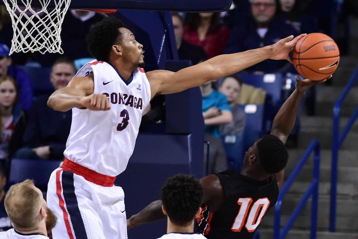 Gonzaga forward Johnathan Williams (3) blocks a shot by Pacific guard Keshon Montague (10) during the first half of an NCAA basketball game, Sat., Feb. 18, 2017, in the McCarthey Athletic Center. (Colin Mulvany / The Spokesman-Review)
