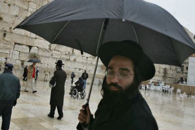 
Jewish worshippers pray at the Western Wall, Judaism's holiest site, in Jerusalem's Old City on Sunday. Israeli Prime Minister Ariel Sharon was taken for another brain scan on Sunday. 
 (Associated Press / The Spokesman-Review)