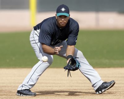 Mariners infielder Jose Lopez knows the team benefits with him at third, but so far he doesn’t like the switch from second. (Associated Press)
