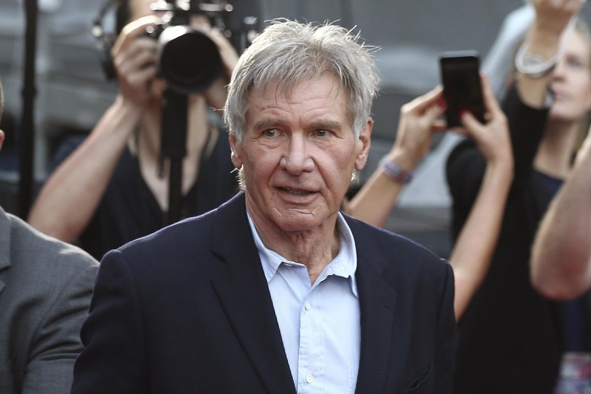 In this December 10, 2015,  photo, Harrison Ford greets fans during a Star Wars fan event in Sydney, Australia. (Rob Griffith / AP)