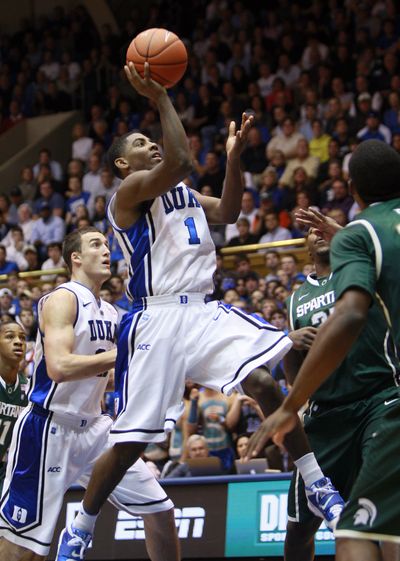 Duke’s Kyrie Irving drives to the basket on his way to 31 points. 