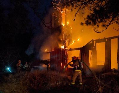 Spokane County Fire District 4 and 9 crews were dispatched to a fully engulfed home off of North Dalton Road at about 5:20 a.m. The home was reportedly a total loss. (Stephanie Stevenson, KHQ)