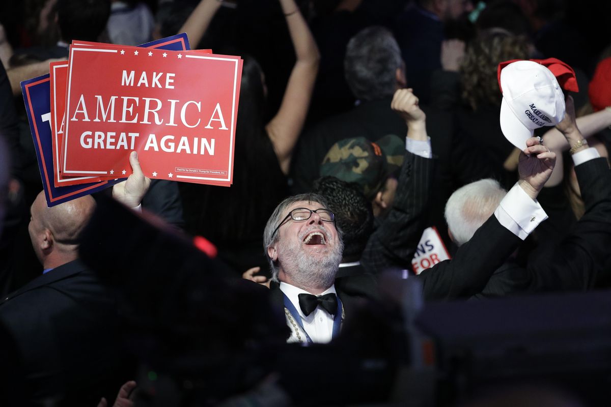 Supporters of Republican presidential candidate Donald Trump react as they watch the election results during Trump