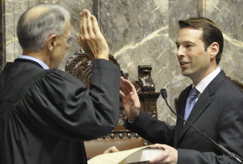 OLYMPIA -- Andy Billig, a Spokane Democrat, takes the oath of office on the first day of the legislative session. (Jim Camden)