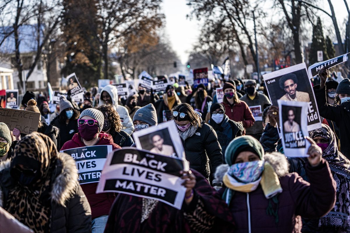 Protesters rally against police brutality, Sunday, Jan. 3, 2021, in Minneapolis, at the gas station where Dolal Idd was shot by Minneapolis police several days earlier.  (Richard Tsong-Taatarii)