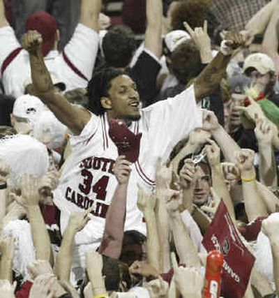 
Renaldo Balkman of South Carolina celebrates with teammates and fans after a 73-61 win over No. 3 Kentucky. 
 (Associated Press / The Spokesman-Review)