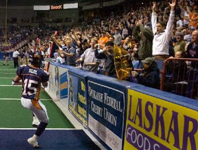 
Spokane Shock fans celebrate as Raul Vijil catches one of his five touchdown against the Everett Hawks.
 (Christopher Anderson / The Spokesman-Review)