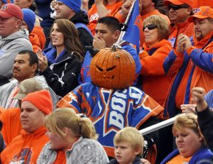 ORG XMIT: IDNCP401 A Boise State fan dons a pumpkin for a head during an NCAA college football game against San Jose State in Boise, Idaho, Saturday afternoon, Oct. 31, 2009. (AP Photo/Idaho Press-Tribune,Mike Vogt) ** MANDATORY CREDIT: MIKE VOGT/IDAHO PRESS-TRIBUNE ** (Mike Vogt / The Spokesman-Review)