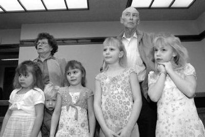 
Virginia and Charlie Crawford, of Columbia Falls, Mont., listen as District Judge Stewart Stadler approves the adoption of their five great-grandchildren last week in Kalispell, Mont. The children are, from left, Jenee Sandlin, 6, Phillip Bruinsma, 3, Renee Sandlin, 6, Saritha Sandlin, 8, and Taressa Sandlin, 7. 
 (Associated Press / The Spokesman-Review)