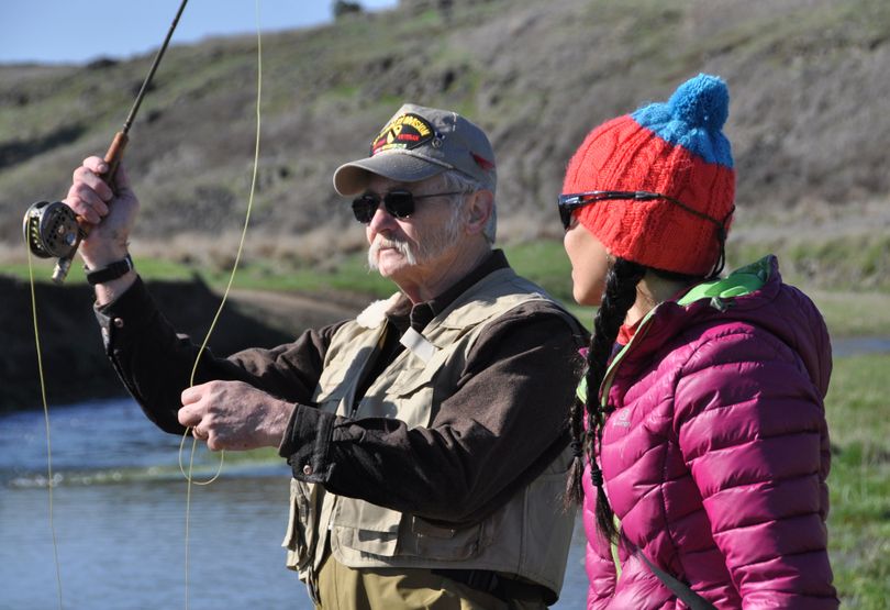 Vietnam Veteran Harold Watters gets a fly casting lesson from Trout TV host Hilary Hutcheson during a Project Healing Waters fishing trip on Crab Creek on March 13, 2013.  (Rich Landers)