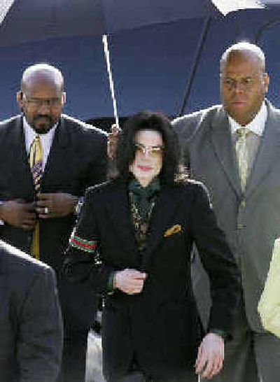
Michael Jackson arrives at the Santa Barbara County courthouse for trial Monday.  
 (Associated Press / The Spokesman-Review)
