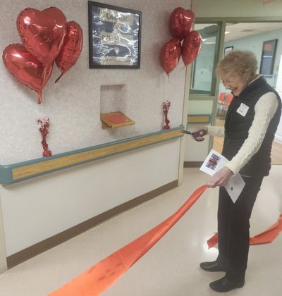 Lu Caudill cuts the ribbon for the new heart rehabilitation program at St. Joseph’s Hospital this month.  (Amanda Sullender / The Spokesman-Review)
