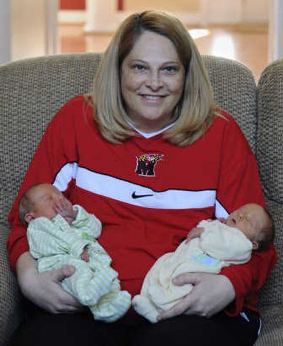 
Frese holds Tyler Joseph, left, and Markus William days after their birth  in Laurel, Md. Associated Press
 (Associated Press / The Spokesman-Review)