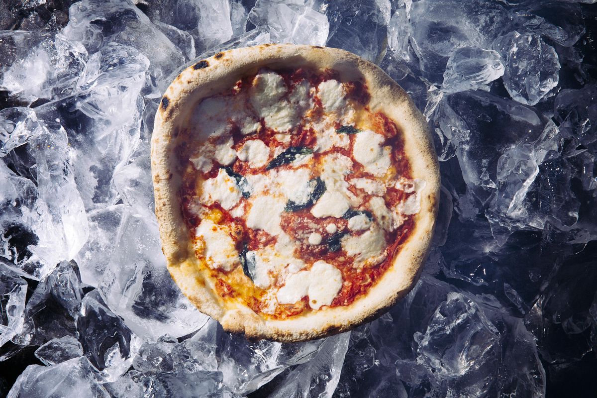 A pie from Dough Pizzeria in San Antonio, one of several independent pizzerias that have begun selling premium frozen pies, Jan. 20, 2023. As shoppers flock to the freezer aisle, artisan pizzaiolos are using new tech and express shipping to give them pies that taste like the real thing. Food Stylist: Frances Boswell.  (HEATHER BLACK/New York Times)