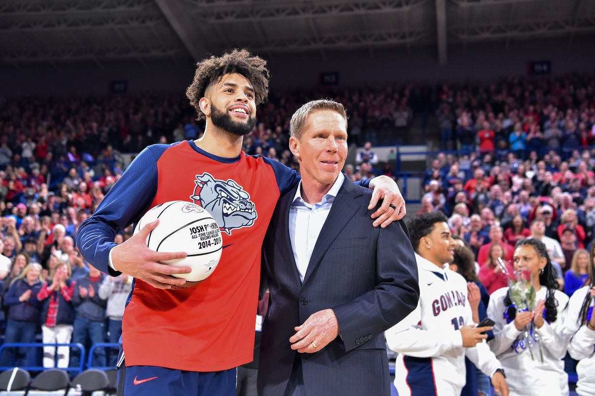 Gonzaga guard Josh Perkins (13) smiles with head coach Mark Few after being presented with a ball commemorating his all-time assists record prior to the Zags
