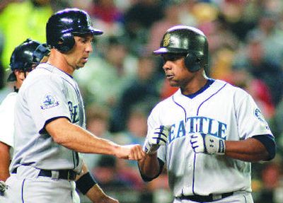 
Seattle's Jose Guillen, right, is congratulated by Raul Ibanez after hitting a three-run home run in the fourth inning.
 (Associated Press / The Spokesman-Review)