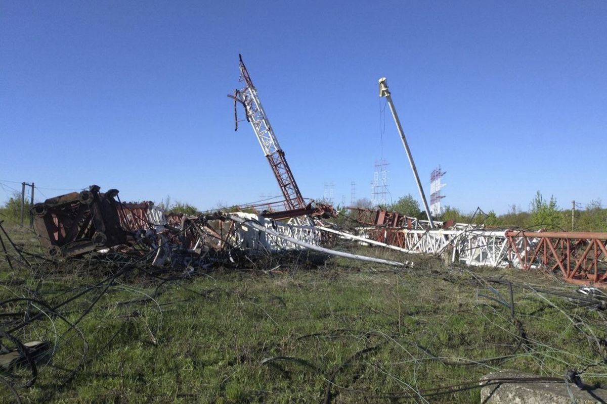 In this photograph released by the Press Center of the Ministry of Internal Affairs of the Pridnestrovian Moldavian Republic, destroyed radio antennas lie on the ground in Maiac, in the Moldovan separatist region of Trans-Dniester, Tuesday, April 26, 2022. Police in the Moldovan separatist region of Trans-Dniester say two explosions on Tuesday morning in a radio facility close to the Ukrainian border knocked two powerful antennas out of service just a day after several explosions believed to be caused by rocket-propelled grenades were reported to have hit the Ministry of State Security in the city of Tiraspol, the region