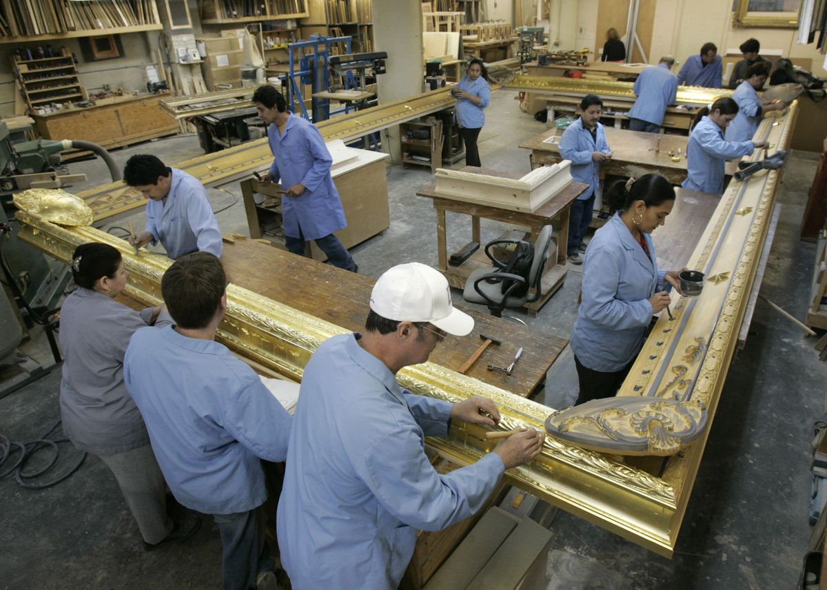 Workers restore a replica of the original decorative frame that once held the famous 22-by- 12-foot painting “Washington Crossing the Delaware” on Tuesday in New York. Associated Press photos (Associated Press photos / The Spokesman-Review)