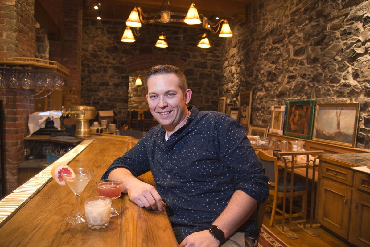 Adam Hegsted sits at the bar with three of Gilded Unicorn’s signature cocktails in this file photo from 2015. (Jesse Tinsley / The Spokesman-Review)