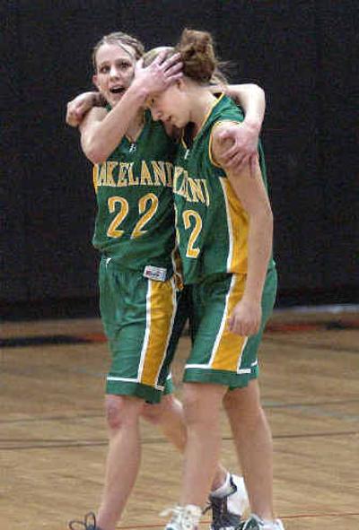 
Lakeland's Jessie Bartlett (22) and Natalie Nichols (32) leave the court after a hard-fought 39-32 overtime win over Post Falls. 
 (Tom Davenport/ / The Spokesman-Review)