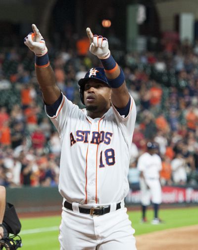 Houston’s Luis Valbuena celebrates his two-run home run against the Seattle Mariners in the eighth inning Wednesday in Houston. (George Bridges / Associated Press)