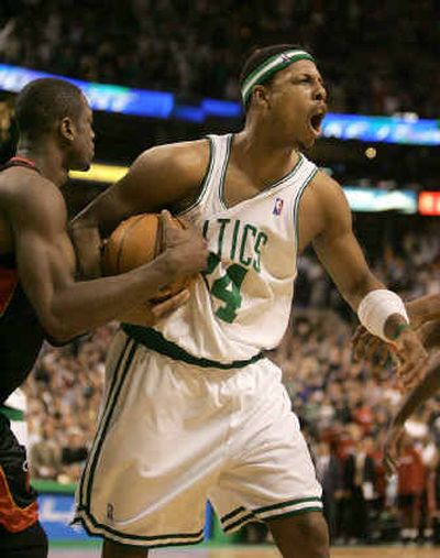 
Boston's Paul Pierce, right, celebrates after the Miami Heat failed to score with seconds to go in the fourth quarter. 
 (Associated Press / The Spokesman-Review)