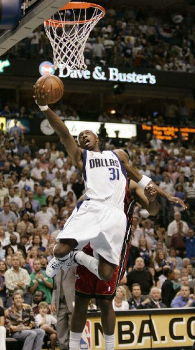 
Dallas' first-game star, Jason Terry, takes a layup in the second quarter Thursday on the way to 32 points. 
 (Associated Press / The Spokesman-Review)