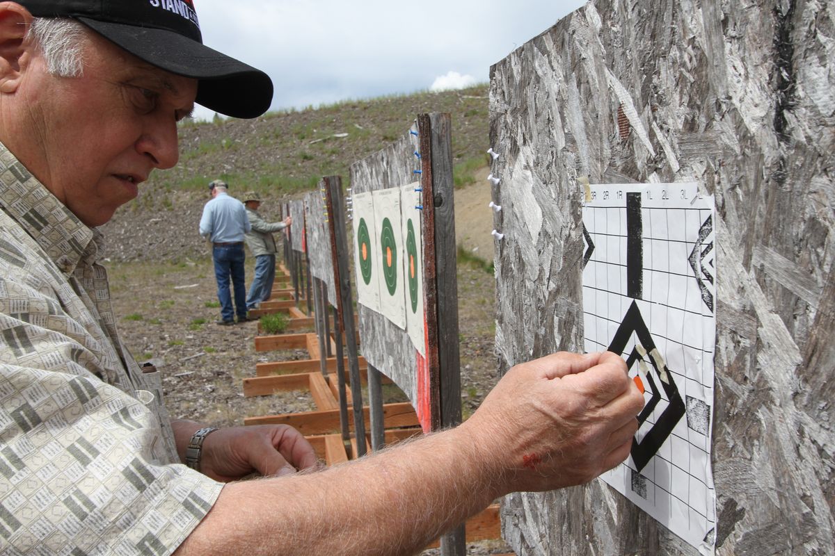Shooters mark their targets during a break at the Farragut Shooting Range. (Duane Rasmussen)