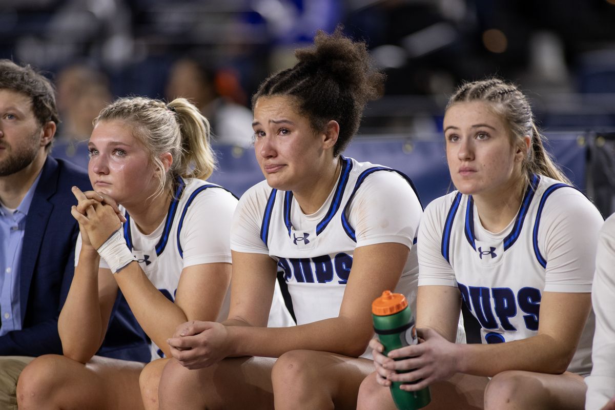 Gonzaga Prep’s Quinn Peterson, left, Belle Hernandez, middle and Aylah Cornwall watch the final seconds of the game against Kennedy Catholic dwindle away during the 4A Girls State Basketball Tournament Thursday, March 5, 2026, in Tacoma. Gonzaga Prep lost to Kennedy Catholic 65-52.  (Patrick Hagerty/For The Spokesman-Review)