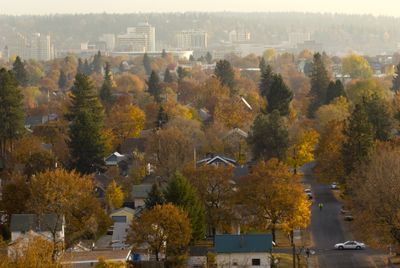 The fall colors surrounding downtown Spokane on Thursday are masked by a layer of haze. October was especially dry this year in the Inland Northwest. (Colin Mulvany / The Spokesman-Review)
