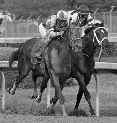 
Calvin Borel riding Street Sense, left, passes Mario Pino riding Hard Spun at the Kentucky Derby. 
 (Associated Press / The Spokesman-Review)