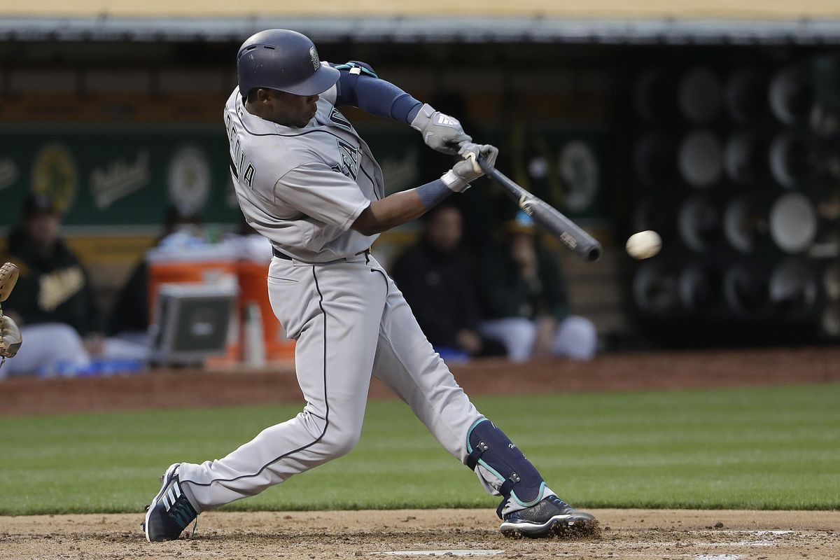 Seattle’s Guillermo Heredia doubles against the Oakland Athletics during the fourth inning Wednesday in Oakland, California. (Jeff Chiu / Associated Press)