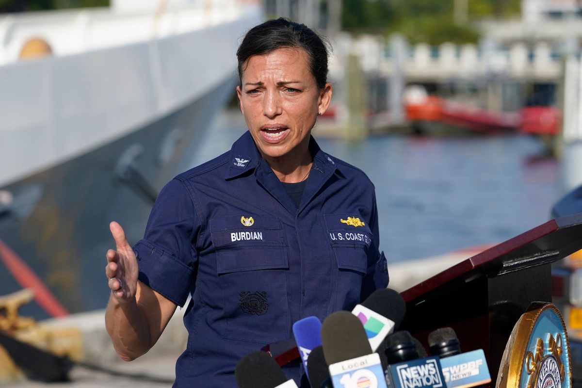 U.S. Coast Guard Captain Jo-Ann F. Burdian details the search of 38 missing migrants at a news conference, Wednesday, Jan. 26, 2022, in Miami Beach, Fla. One migrant was found clinging to the hull of an overturn vessel and one body was recovered off the coast of Fort Pierce, Fla. The migrants left the Bahamas on Saturday in what the Coast Guard suspects is a human smuggling operation.  (Marta Lavandier)