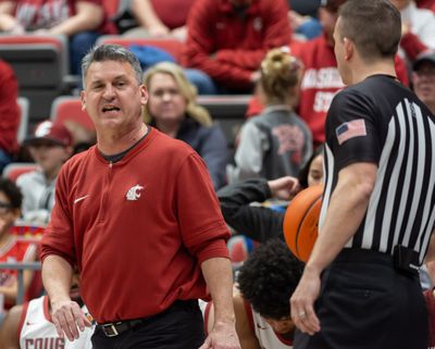 Washington State head coach Kyle Smith talks with a referee in the second half of a game against Stanford on Saturday, Feb. 17, 2024, at Beasley Coliseum in Pullman, Wa.  (Geoff Crimmins/For The Spokesman-Review)