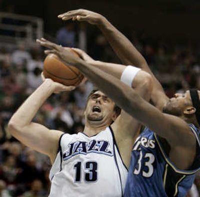 
Jazz forward Mehmet Okur, left, had 16 points, nine rebounds and five assists in Utah's rout of Washington. Associated Press
 (Associated Press / The Spokesman-Review)