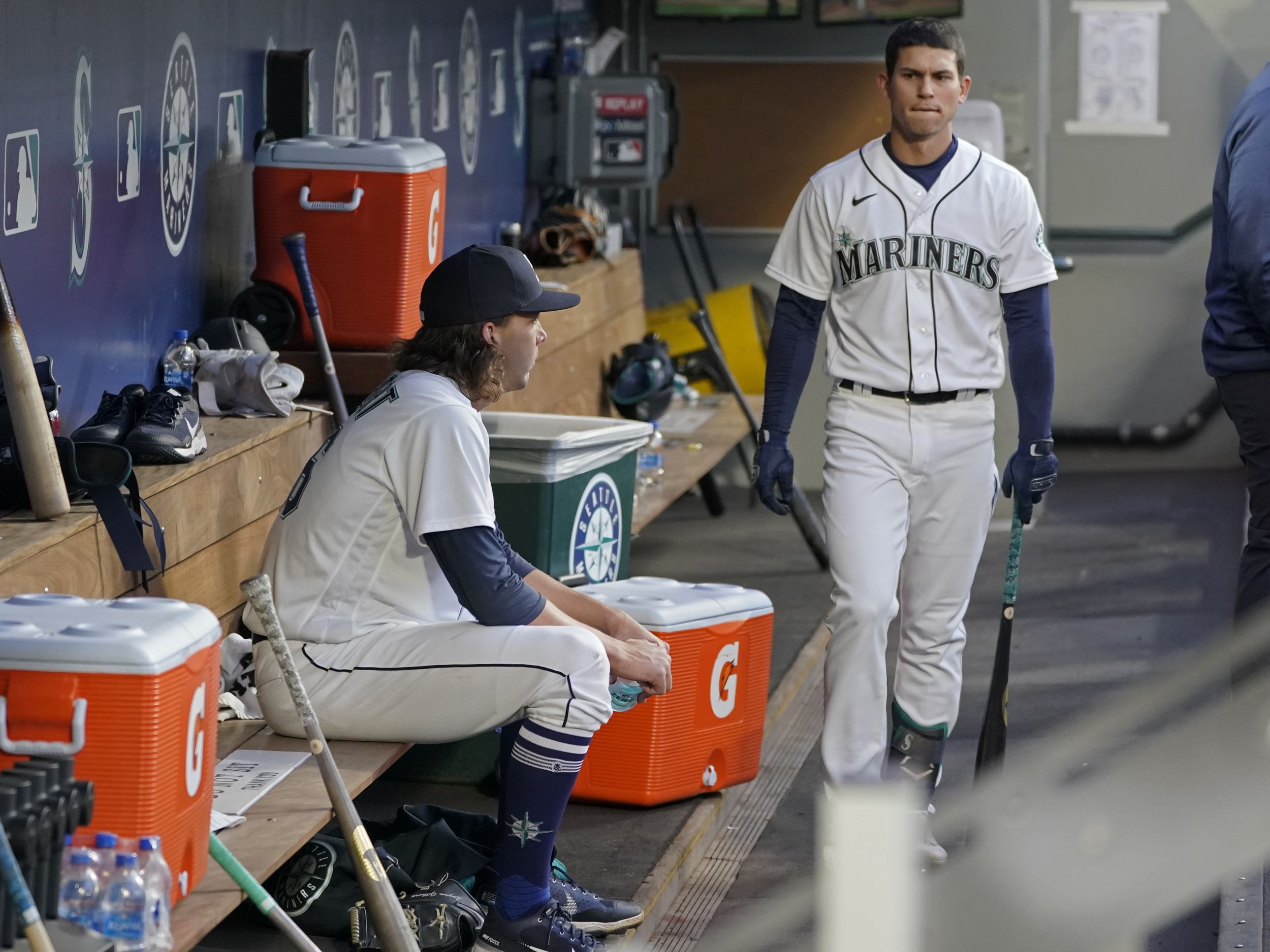 Seattle Mariners' Tom Murphy reacts in the dugout after he hit a